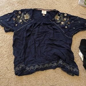 Blue blouse with floral print on the sleeves